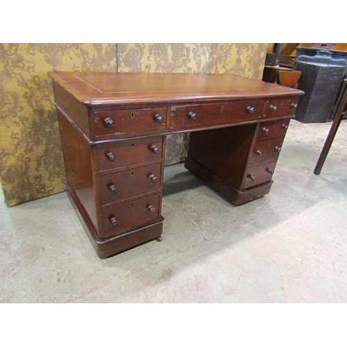 2290 - A Victorian  mahogany pedestal writing desk fitted with nine drawers with inset leather top 118 cm w... 