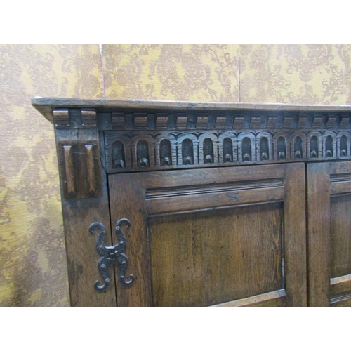 2300 - A good quality old English style carved and panelled hanging robe with hand wrought iron hinges, 121... 