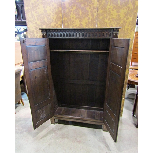 2300 - A good quality old English style carved and panelled hanging robe with hand wrought iron hinges, 121... 