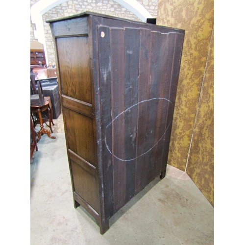 2300 - A good quality old English style carved and panelled hanging robe with hand wrought iron hinges, 121... 