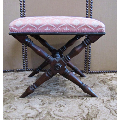 2306 - A Victorian mahogany x framed stool with turned supports and upholstered seat, 51 cm in length