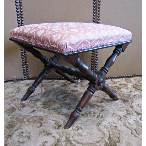 2306 - A Victorian mahogany x framed stool with turned supports and upholstered seat, 51 cm in length