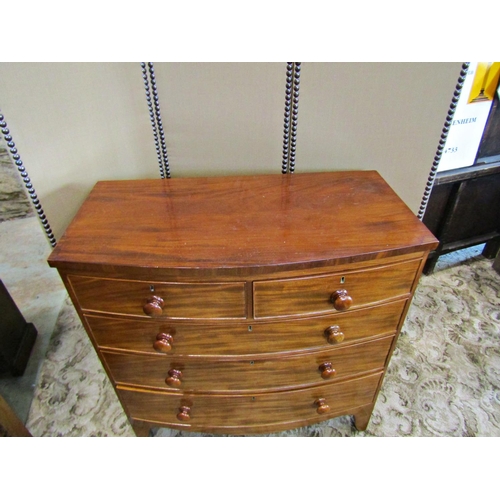 2307 - A Victorian mahogany bow fronted chest of three long and two short drawers on splay supports , 103 c... 