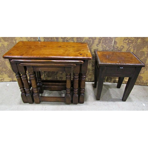 2320 - A nest of three old English oak occasional tables on turned supports 61cm wide and smaller, together... 