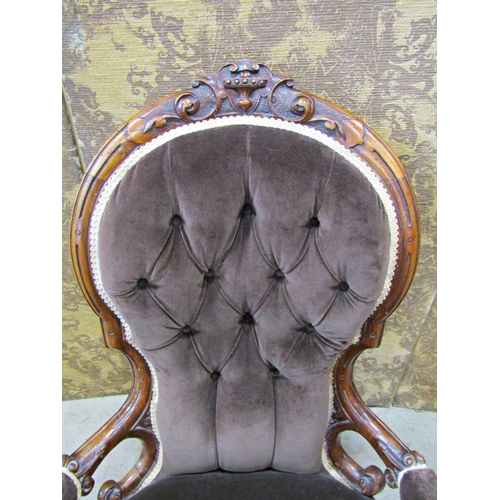 2323 - A Victorian spoon back drawing room chair with carved and moulded walnut show wood frame and later u... 