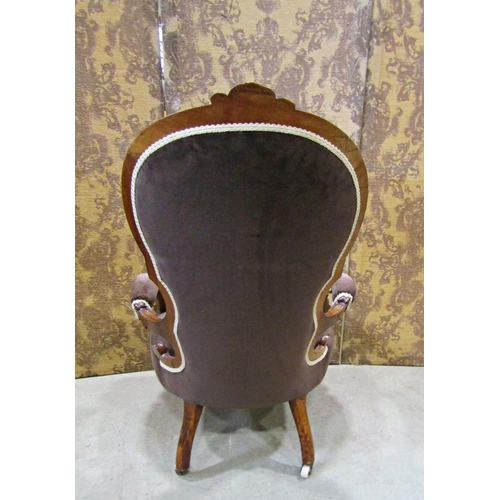 2323 - A Victorian spoon back drawing room chair with carved and moulded walnut show wood frame and later u... 