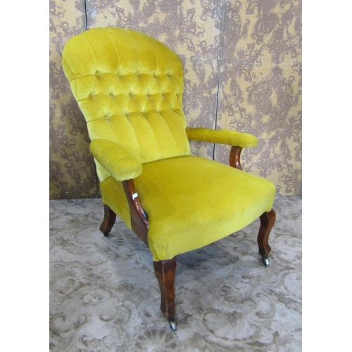 2324 - A Victorian drawing room chair with buttoned back and upholstered in a mustard coloured fabric