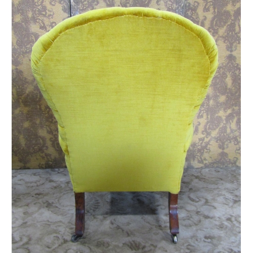 2324 - A Victorian drawing room chair with buttoned back and upholstered in a mustard coloured fabric