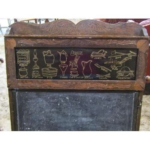 2338 - A late 19th century American child's folding easel enclosing a blackboard, the upper panel showing a... 