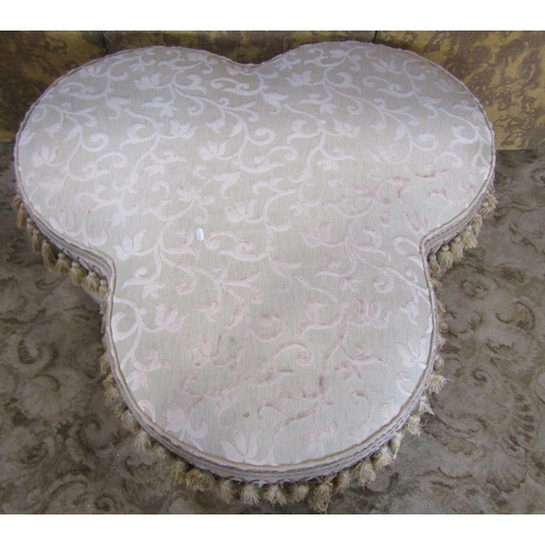 2339 - A trefoil shaped stool with upholstered finish and tasselled boarders, 92cm