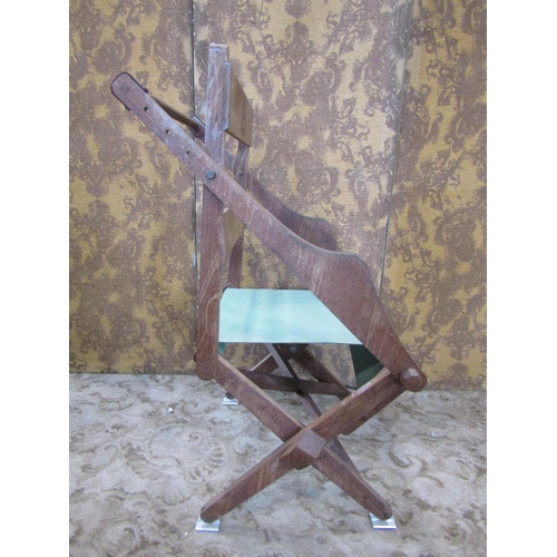 2340 - An oak framed adjustable chair with canvas seat