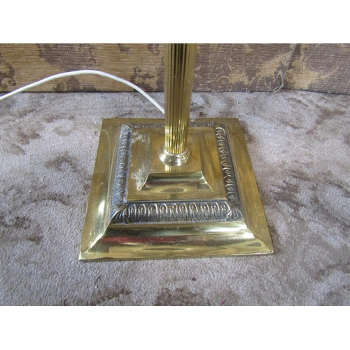 2349 - A set of three brass column lamp standards on square cut bases, together with three industrial green... 