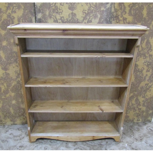 2350 - A stripped pine open bookcase enclosing fitted shelves, 122cm high x 106cm wide