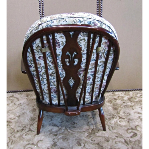 2353 - An Ercol drawing room chair with upholstered seat and back