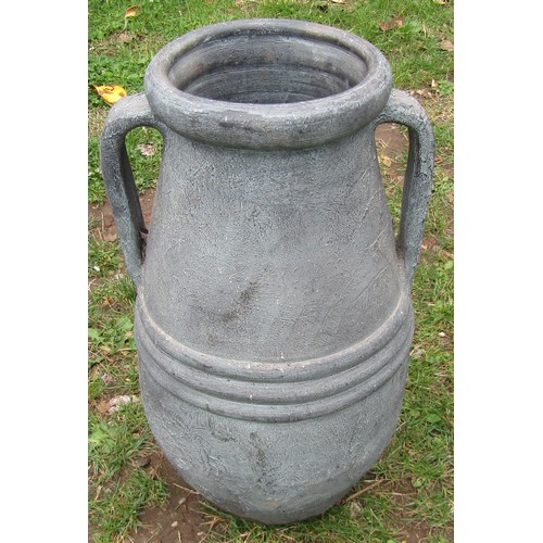 2067 - A small Mediterranean weathered buff coloured terracotta amphora, with moulded loop handles, raised ... 