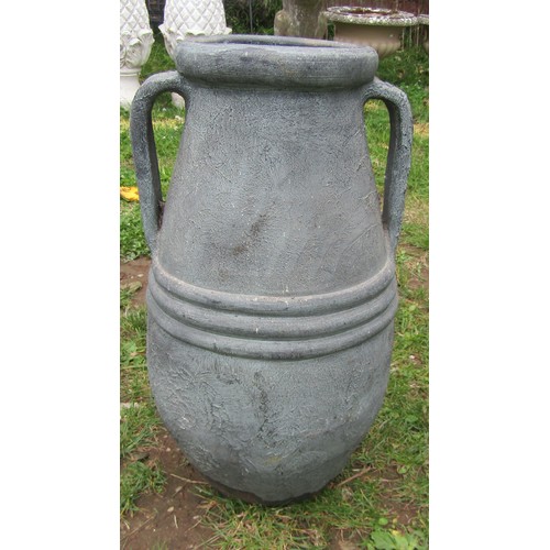 2067 - A small Mediterranean weathered buff coloured terracotta amphora, with moulded loop handles, raised ... 