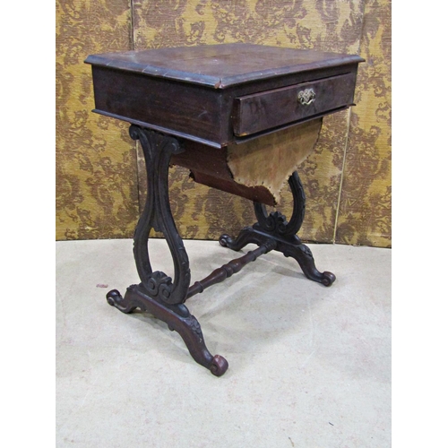 2191 - A 19th century mahogany sewing table with frieze drawer raised on open scrolled and lyre shaped supp... 