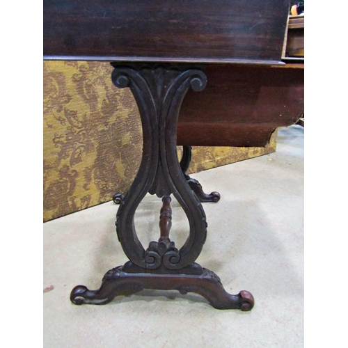 2191 - A 19th century mahogany sewing table with frieze drawer raised on open scrolled and lyre shaped supp... 