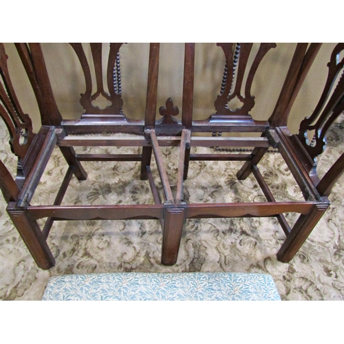 2243 - An antique mahogany seat formed from four mahogany chair backs with interlaced splats, raised on squ... 