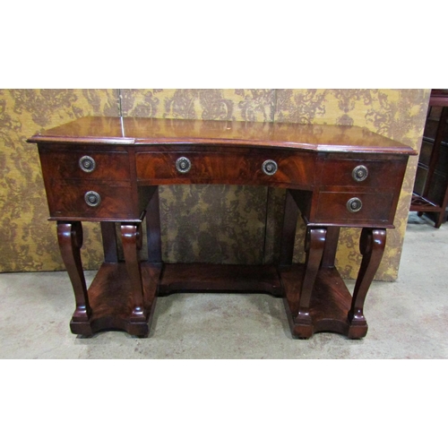 2287 - 19th century mahogany side table the concave central drawer flanked by four small drawers raised on ... 