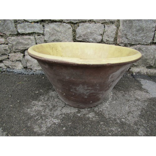 2126 - A terracotta dairy/preserving pan of circular tapered form with glazed interior 49 cm diameter x 28 ... 