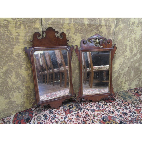 2630 - Two Georgian mahogany wall mirrors with shaped and fretted outline, one decorated with a gilded ho-h... 