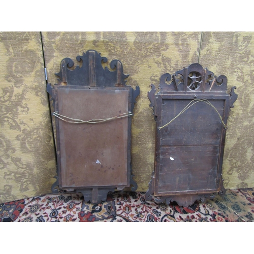 2630 - Two Georgian mahogany wall mirrors with shaped and fretted outline, one decorated with a gilded ho-h... 