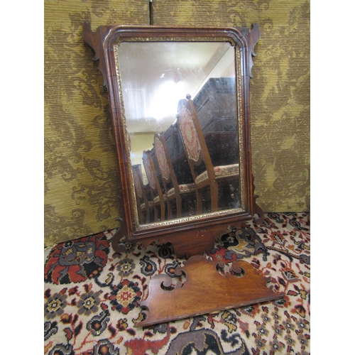 2630 - Two Georgian mahogany wall mirrors with shaped and fretted outline, one decorated with a gilded ho-h... 