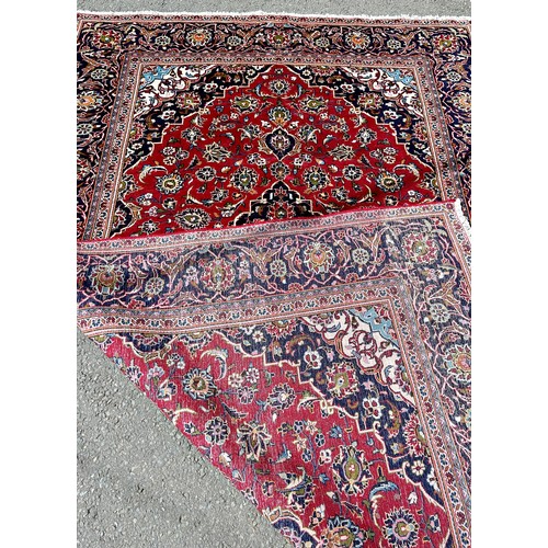 1669 - A good quality Central Persian Kashan carpet, with a central blue floral medallion and stylised flow... 