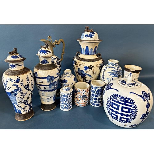 1079 - A collection of 19th century and later Chinese blue and white ware including two oviform vases, lidd... 