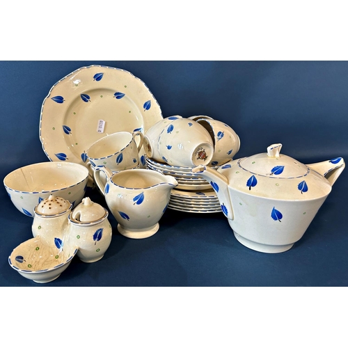 1134 - A Crown Ducal hand painted tea service with blue feather detail, accompanied by a matching condiment... 