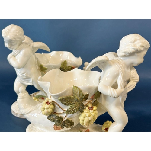 1147 - A pair of 19th century cornucopia Moore in the form of cherubs, the horns surrounded by flowering ho... 