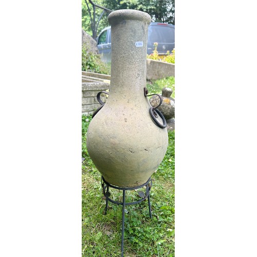 2082 - An unusually small weathered clay chimenea and stand, 70 cm high