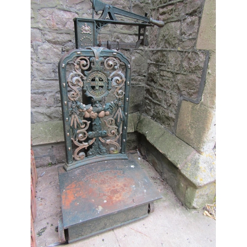 2060 - A set of Parnall & Sons Bristol cast iron sack scales, with decorative pierced back plate