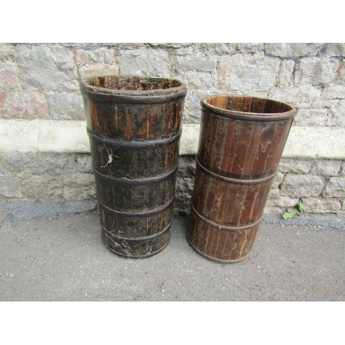 2065 - An eastern coopered and steel banded wooden cylindrical bucket/vessel, 35cm diameter x 69cm high, to... 