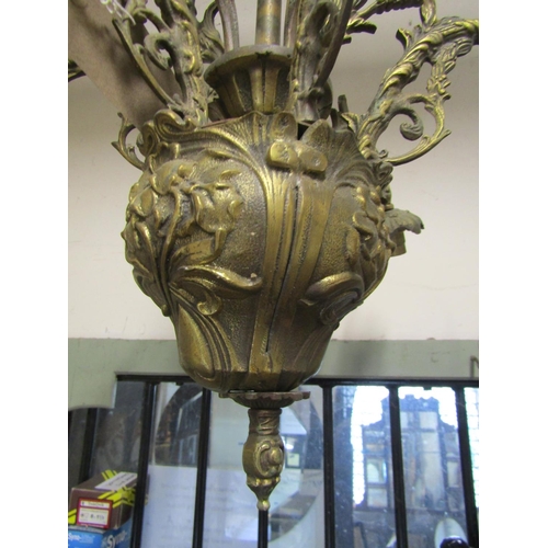 2113 - A heavy cast gilt metal hanging ceiling light with six swan neck acanthus branches, and further deco... 