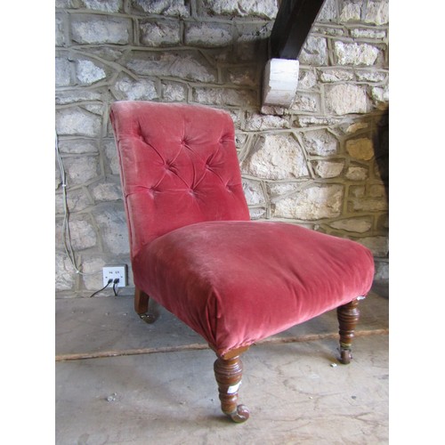 2341 - A simple Victorian drawing room chair with buttoned back on turned supports