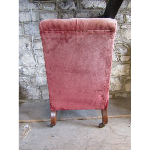 2341 - A simple Victorian drawing room chair with buttoned back on turned supports