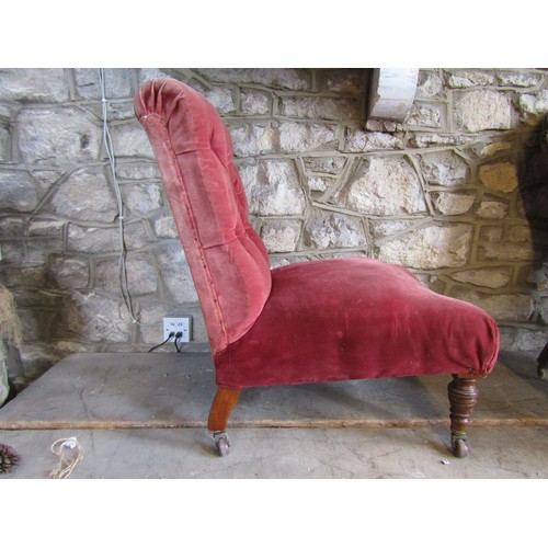 2341 - A simple Victorian drawing room chair with buttoned back on turned supports