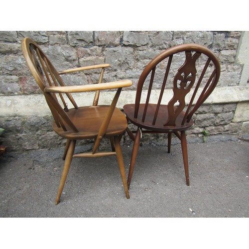 2178 - A set of four (3+1) Ercol hoop and stick back dining chairs with fleur de lis splats together with a... 