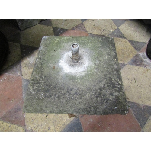 2083A - A weathered natural carved stone finial raised on a square tapered cap, 32 cm high