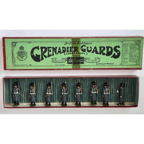 Britains set 312 (1928 version) Grenadier Guards in Greatcoats;  7 marching guards and Officer with drawn sword in original green label campaign Whisstock box, no slot insert