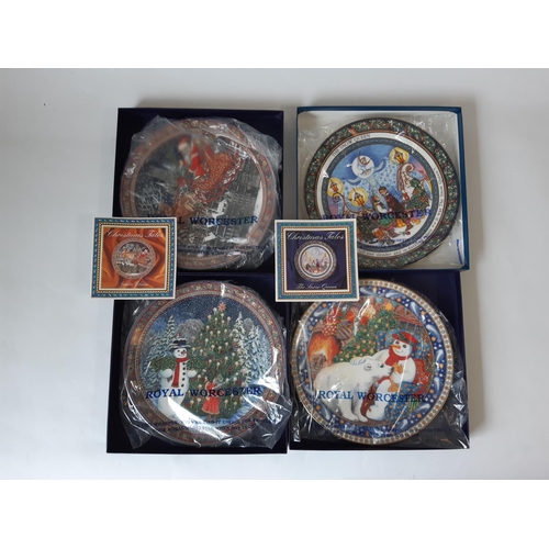 1111 - A collection of 17 Royal Worcester Christmas themed decorative plates including Christmas Tales seri... 