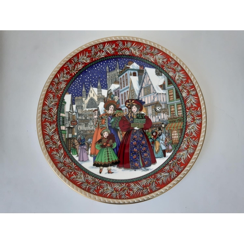 1111 - A collection of 17 Royal Worcester Christmas themed decorative plates including Christmas Tales seri... 