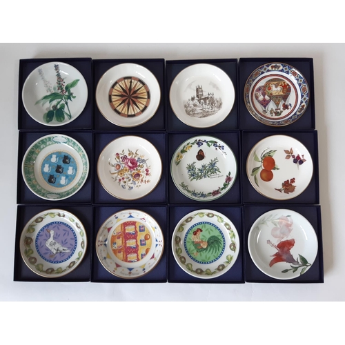 1131 - A collection of 34 coaster dishes by Royal Worcester, all boxed, including floral, golfing scenes, l... 