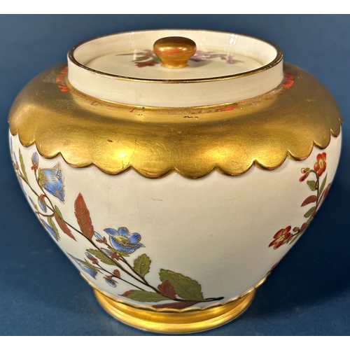 1091 - A Worcester porcelain oviform jar and cover with hand painted floral spray detail within gilded bord... 