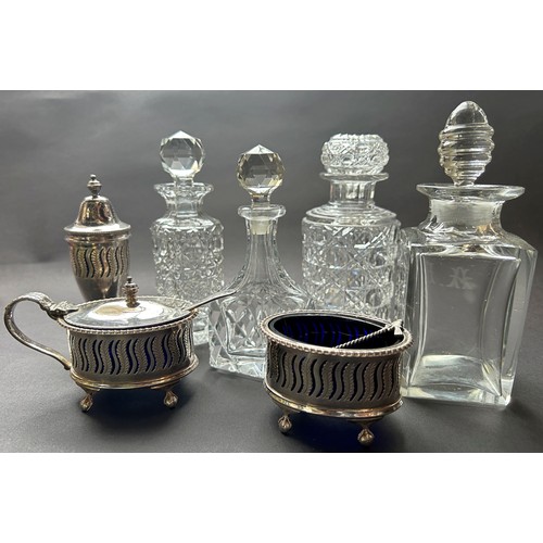 1198 - A collection of toilet water bottles and stoppers, silver plated condiments