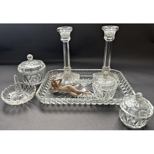 1199 - An early 20th century glass dressing table set of a pair of candlesticks, three jars, a ring stand o... 