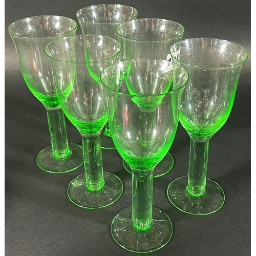 1181 - a Waterford crystal carafe and six pale green wine glasses, a ruby red crimped dish with a cover and... 