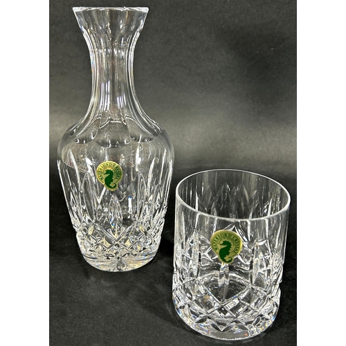 1181 - a Waterford crystal carafe and six pale green wine glasses, a ruby red crimped dish with a cover and... 